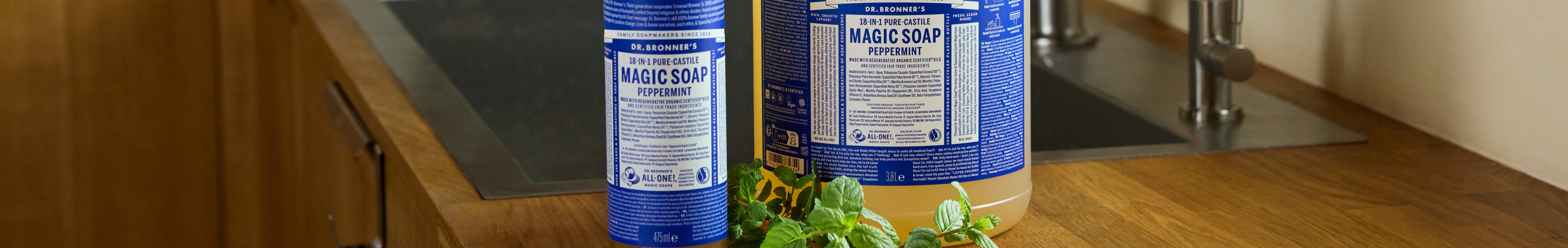 Dr. Bronners 18 in 1 Pure Castile Magic Soap Peppermint label. Blue and white design with detailed text about regenerative organic oils. Instructions for diluting and various uses like body wash and shaving