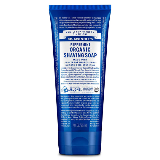 A blue tube labeled Dr. Bronners Peppermint Organic Shaving Soap is displayed. It highlights fair trade ingredients, smooth and moisturizing properties, and contains text detailing usage and benefits. The background is plain white [7 oz]