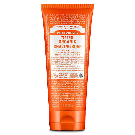 An orange tube labeled Dr. Bronners Organic Shaving Soap with detailed text about ingredients and usage. Features eco certification symbols, promoting natural, vegan, and cruelty free soap ideal for sensitive skin [7 oz]