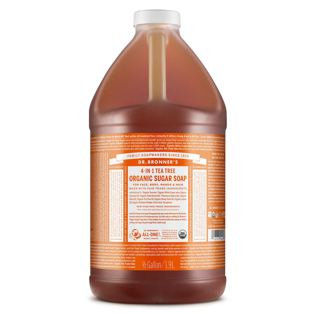 A large bottle of Dr. Bronners 4 in 1 Tea Tree Organic Sugar Soap, marked Gallon 1.9L, featuring detailed product information on the label, ideal for eco friendly and natural cleaning [1/2 Gallon]