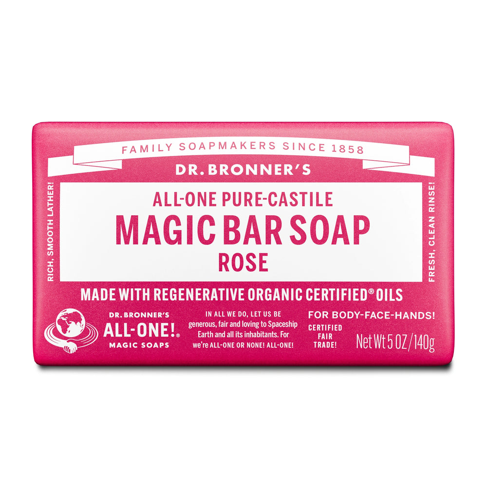A bar of Dr. Bronners All One Pure Castile Magic Bar Soap, Rose, sits packaged with text emphasizing regenerative organic certified oils, suitable for body, face, and hands. Net Wt 5 oz140g [5 oz]