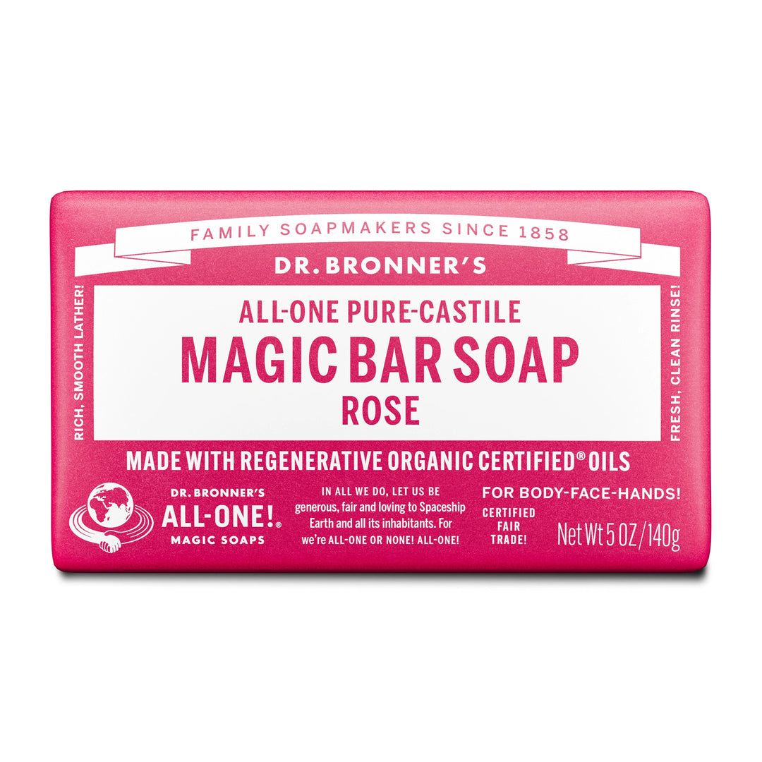 A bar of Dr. Bronners All One Pure Castile Magic Bar Soap, Rose, sits packaged with text emphasizing regenerative organic certified oils, suitable for body, face, and hands. Net Wt 5 oz140g [5 oz]