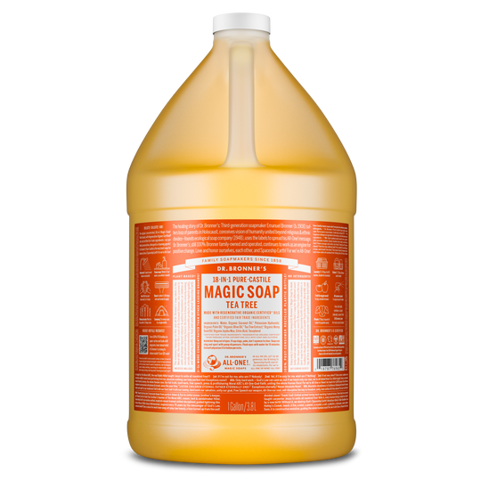 A gallon bottle labeled Dr. Bronners 18 in 1 Pure Castile Magic Soap Tea Tree stands upright with detailed orange and white text. It highlights natural, eco friendly, and vegan ingredients [1 Gallon]