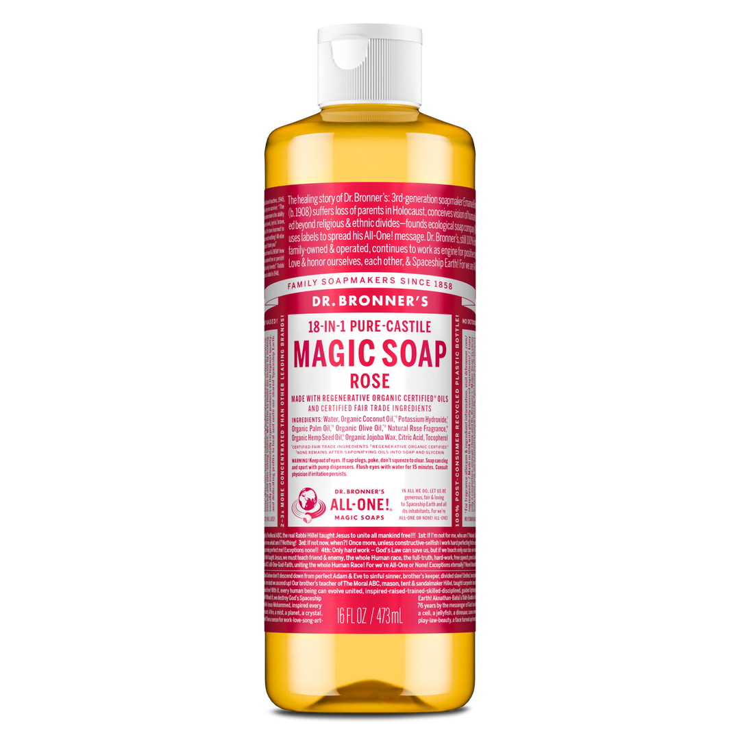 Dr. Bronners 18 in 1 Pure Castile Magic Soap Rose bottle features a red label with white text. It includes organic ingredients like coconut and olive oils, emphasizing its eco friendly and versatile uses. 473ml [16 oz]