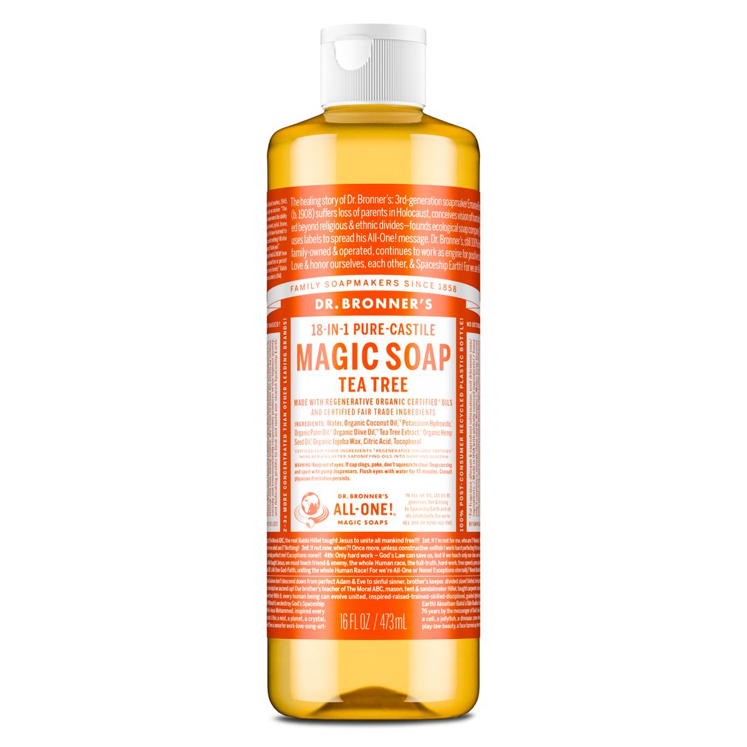 A bottle of Dr. Bronners 18 in 1 Pure Castile Magic Soap, Tea Tree variant, filled with amber liquid sits upright. The label emphasizes its organic certification and multi purpose use in personal care and cleaning [16 oz]