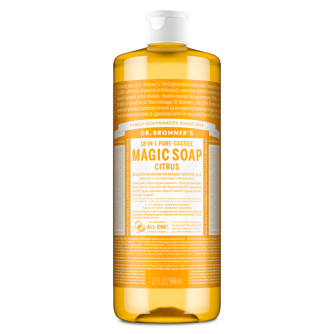 A large bottle of Dr. Bronners 18 in 1 Pure Castile Magic Soap, Citrus variant, stands upright. The label highlights family soapmakers, organic certification, and versatility for multiple cleaning uses. Capacity is 32 fl oz [32 oz]