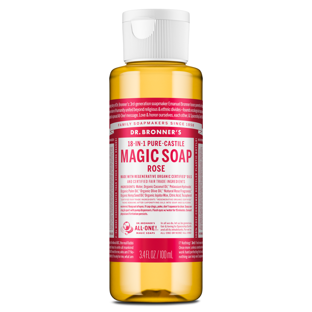 A bottle of Dr. Bronners Magic Soap in rose scent stands upright with a translucent container and pink label displaying text about its organic certification and versatile uses, emphasizing eco friendly benefits [3.4 oz]