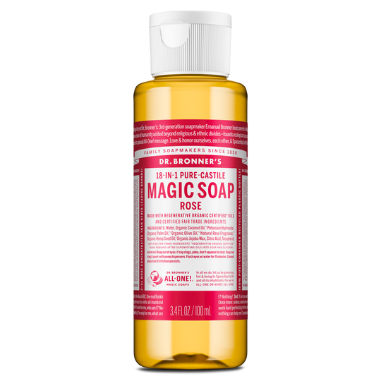 A bottle of Dr. Bronners Magic Soap in rose scent stands upright with a translucent container and pink label displaying text about its organic certification and versatile uses, emphasizing eco friendly benefits [3.4 oz]