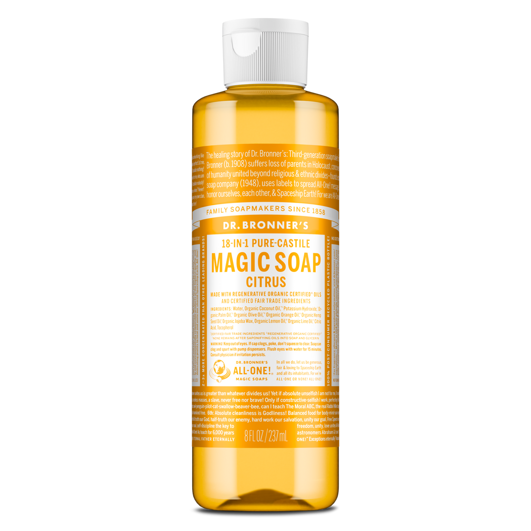 A bottle of Dr. Bronners 18 in 1 Pure Castile Magic Soap, Citrus scent, stands upright. The label details organic certification and eco friendly ingredients, emphasizing sustainability and versatility. Text includes 8 fl oz 237 ml [8 oz]