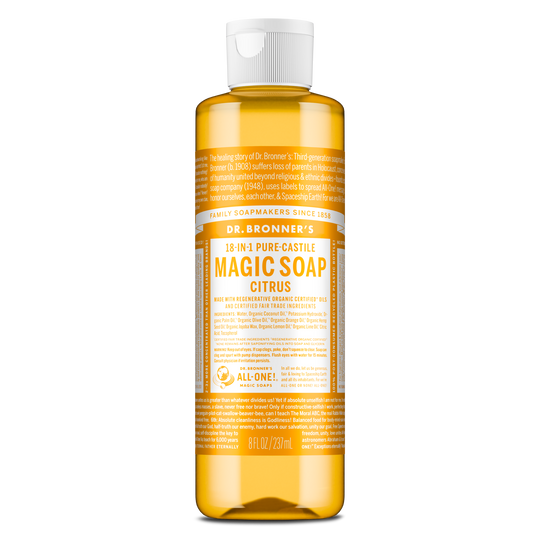 A bottle of Dr. Bronners 18 in 1 Pure Castile Magic Soap, Citrus scent, stands upright. The label details organic certification and eco friendly ingredients, emphasizing sustainability and versatility. Text includes 8 fl oz 237 ml [8 oz]