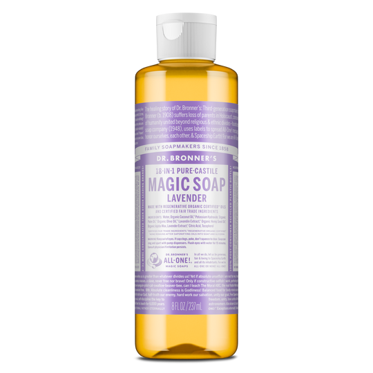 A bottle of Dr. Bronners 18 in 1 Pure Castile Magic Soap Lavender is seen standing upright. Its label features extensive text detailing ingredients and uses against a plain background [8 oz]